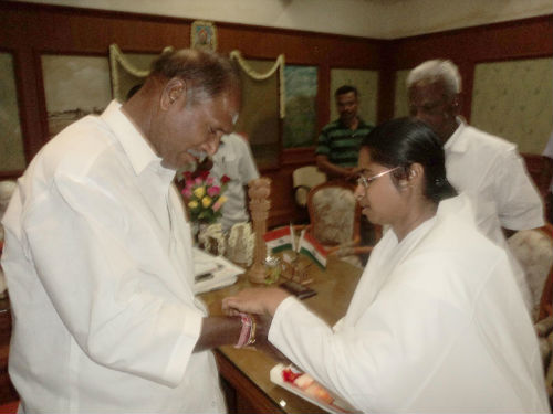 Sister B.K.Kavita Tying rakhi to Hon'ble Chief Minister of Pondicherry- Thiru. N . Rangasamy