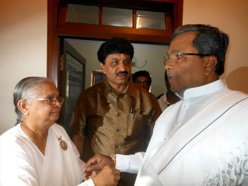 K. Siddaramaiah, Chief Minister of Karnataka being tied sacred Rakhi by BK Padma behen of Bangalore
