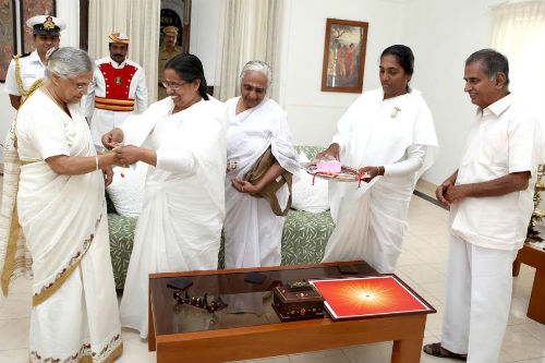 Brahmakumaris Tying Rakhi to the Hon. Governor of Kerala, Her Excellency Smt Shiela Dixit